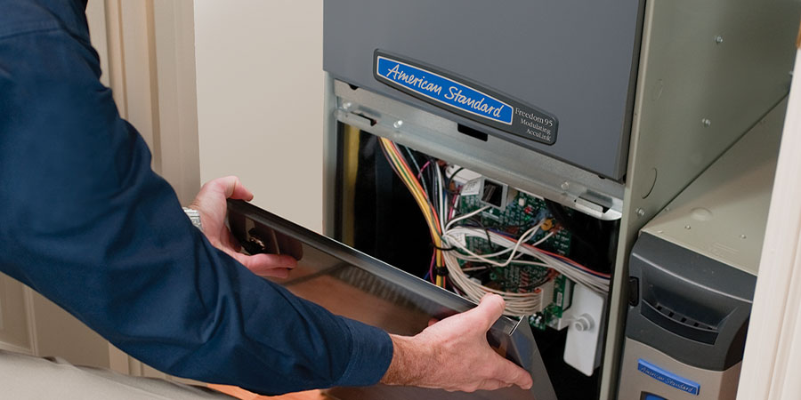 tech checking out American Standard Heat unit